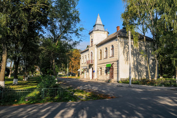 Fototapeta na wymiar Historical town hall in Bilshivtsi, Ivano-Frankivsk region, Ukraine at sunny summer morning