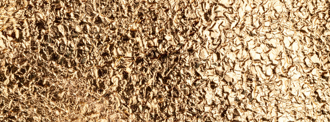 Banner golden crumpled shiny texture.