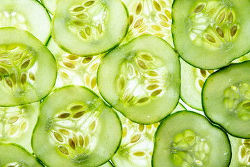 a sliced cucumber close up - textured background