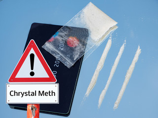 crystal meths line with money card and bag warning sign