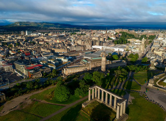 Aerial summer view of Edinburgh Scotland, with Calton Hill and its famous landmarks such as the Nelson Monument, National Monument of Scotland and Dugald Stewart Monument