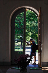 Stockholm, Sweden   A woman stands in the main entrance to the rococco- inspired Svartsjo Castle on Lake Malaren.