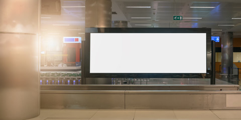 spacious empty white advertise banner in black frame stands in building of airport station