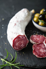 Salami with olives and fresh rosemary