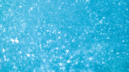 Abstract background blue bokeh circles and dots texture.