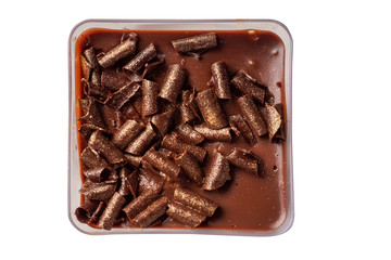 Fine chocolate dessert top down view. Isolated on white. Chocolate chunks on top.