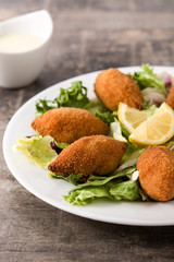 Traditional lebanese kibbeh on wooden table