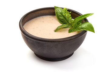White Bechamel sauce in a bowl, isolated on white background