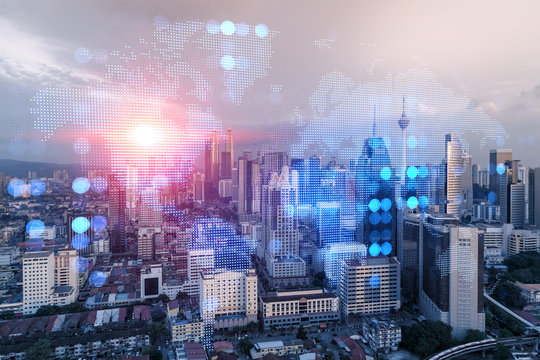 Glowing hologram of Earth planet map on aerial panoramic cityscape of Kuala Lumpur at sunset, Malaysia, Asia. The concept of international business in KL. Multi Exposure. - Powered by Adobe