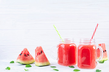 Fresh delicious watermelon smoothie with ice on white background