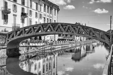 Bridge on Naviglio Grande, Naviglio Grand canal full with restaurants, bars and people in Milan