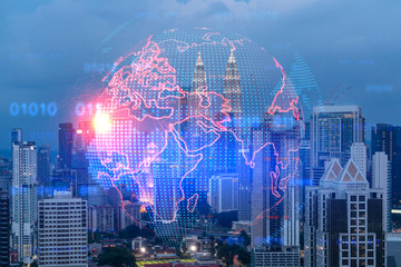 Hologram of Earth planet map on night panoramic cityscape of Kuala Lumpur, Malaysia, Asia. The concept of international companies in KL. Multi Exposure.