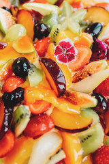 Cake with fruits isolated on white background, top view. Strawberry and pear, fig and grapes, plum and peach.