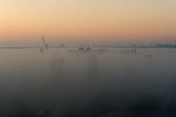 Fototapeta premium Vague silhouettes of Koblevo skyline in the morning mist, Ukraine