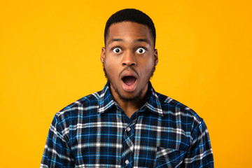 Shocked African Man Looking At Camera In Amazement, Studio Shot