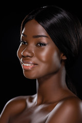 Fototapeta premium portrait of african american naked woman smiling isolated on black