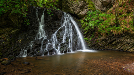 The Lower Falls at Fairy Glen Nature Reserve. A popular woodland walk with two delightful waterfalls, close to the village of Rosemarkie, in the Scottish Highlands