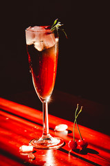 Beautiful shiny drink with ice decorated on black background