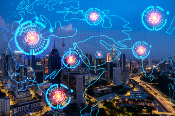 Hologram of Earth planet map on night panoramic cityscape of Kuala Lumpur, Malaysia, Asia. The concept of international companies in KL. Multi Exposure.