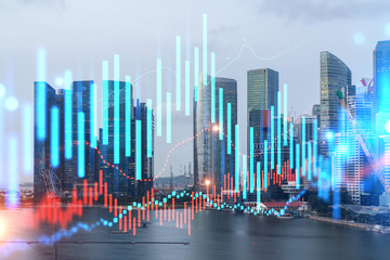 Forex and stock market chart hologram over panorama city view of Singapore, the financial center in Asia. The concept of international trading. Double exposure.