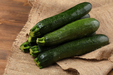 Organic fresh green zucchini, vegetable background.
