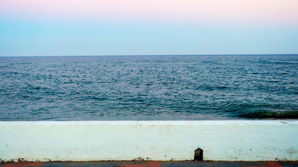 Vista de mar desde el paseo maritimo de La Cala de Mijas al atardecer