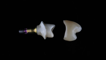 dental base for installing a ceramic crown, top view on a black background