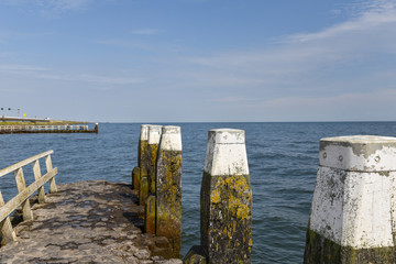 bollards on a pier in the IJsselmeer