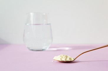 A spoonful of collagen powder. Beauty concept.