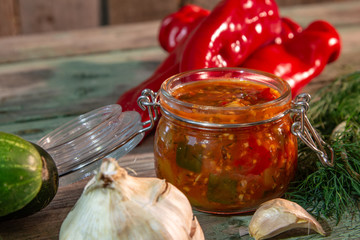 Autumn homemade preserved vegetables in glass jars.  Vegetable summer snack. Vegetarian food concept, copy space.