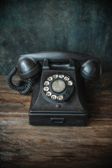 Olld telephone on wooden table