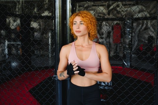 Woman boxer training fighter in gym. Concept mma sport.
