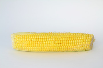 Raw corn on a white the background
