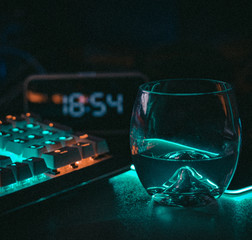 glass of whiskey on blue background
