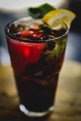Fruit non-alcoholic fresh drink in misted glass with ice