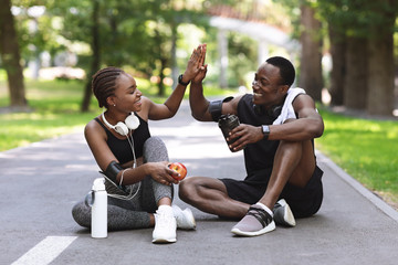 Relationship Goals. Active African Couple High-Fiving To Each Other After Outdoor Training