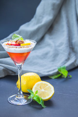 Italian dessert panna cotta with strawberries and lemon