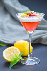 Italian dessert panna cotta with strawberries and lemon