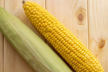 Yellow juicy Kachan corn on a wooden background