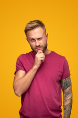 Thoughtful man looking at camera