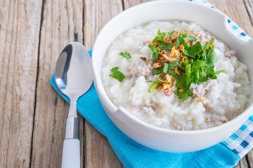 Breakfast rice porridge on a wooden table