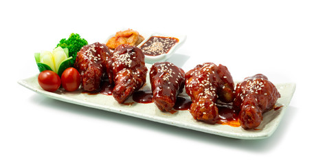 Korean Fried Chicken (Dakgangjeong) Spicy Fried Chicken Drumette wing deep fried served Kimchi and Yeokchon sauce