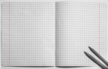 Top view of a blank open squared notebook, pen and pencil. Flat lay, copy space, black and white