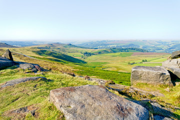 From Stanage Edge across the Derbyshire landscape in the morning sun