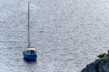 An isolated sailboat on the water
