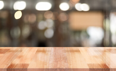 Empty wooden table top with lights bokeh on blur restaurant background