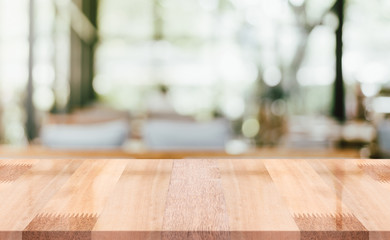 Empty wooden table top with lights bokeh on blur restaurant background