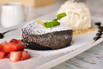 Chocolate lava with icing sugar, dessert, appetizer after the main meal.