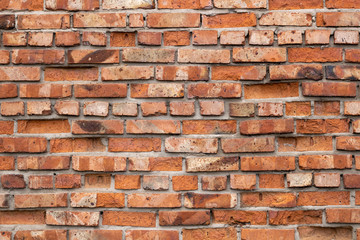 Wall of red bricks. Texture or background of bricks.