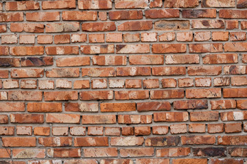 Wall of red bricks. Texture or background of bricks.